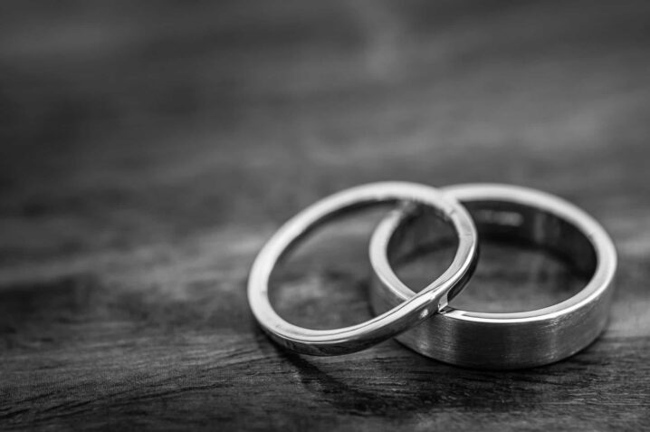 Palladium Wedding Rings On A Wooden Surface