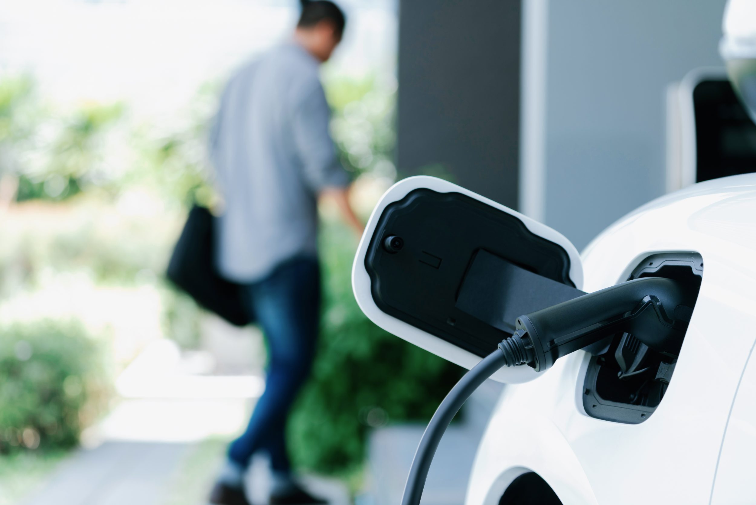Electric vehicle charging overnight in a private garage box